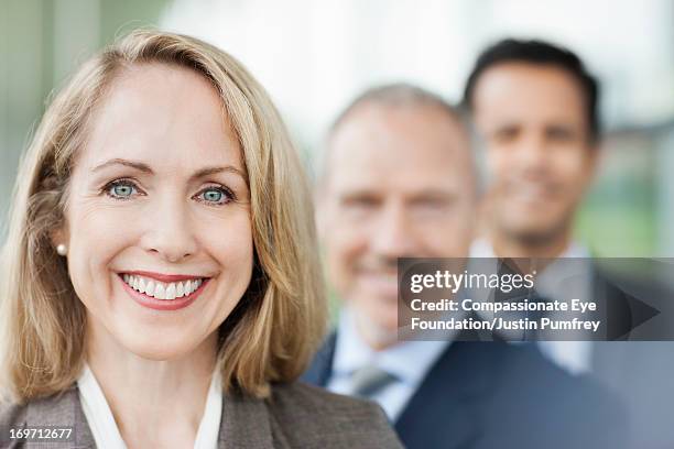 close up of smiling business people - tie close up stock-fotos und bilder