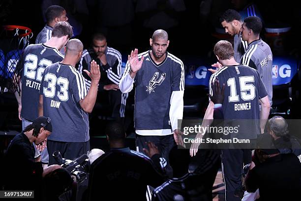 Tim Duncan of the San Antonio Spurs greets his teammates during player introductions against the Memphis Grizzlies during Game One of the Western...