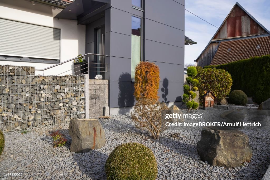Gravel garden in front of a detached house, stones instead of plants are worthless from an ecological point of view, Merklingen, Baden-Wuerttemberg, Germany