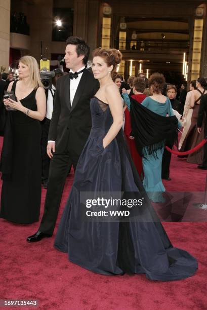 Keanu Reeves and Sandra Bullock attend the 78th Annual Academy Awards at the Kodak Theater. Bullock wears an Angel Sanchez gown.