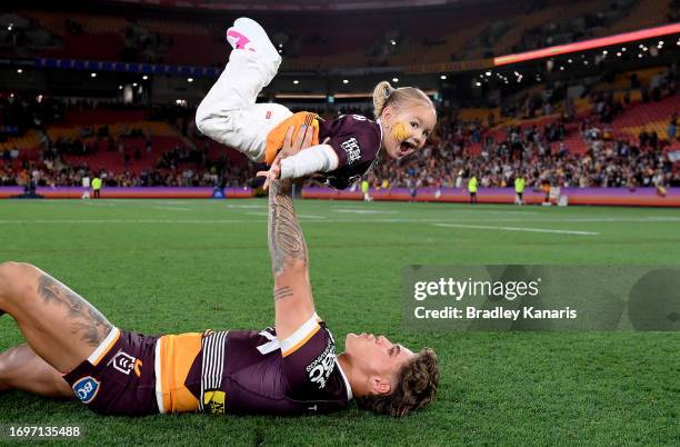 Reece Walsh of the Broncos celebrates with his daughter Leila after winning the NRL Preliminary Final match between the Brisbane Broncos and New...