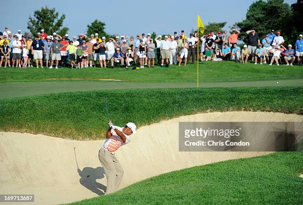 Tiger Woods plays from a bunker on the 10th hole during the second round of the Memorial Tournament presented by Nationwide Insurance at Muirfield...
