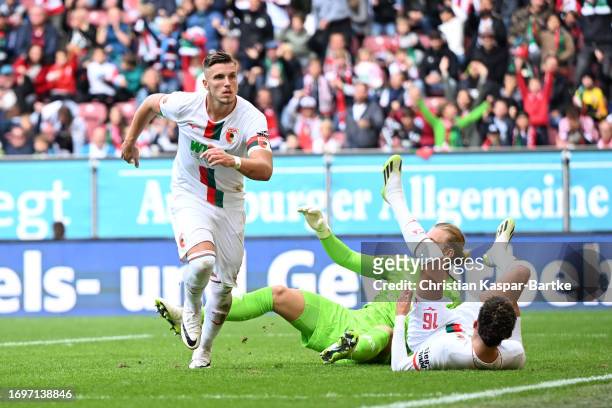 Ermedin Demirovic of FC Augsburg celebrates after scoring the team's second goal during the Bundesliga match between FC Augsburg and 1. FSV Mainz 05...