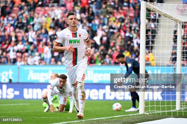 Ermedin Demirovic of FC Augsburg celebrates after scoring the team's second goal during the Bundesliga match between FC Augsburg and 1. FSV Mainz 05...