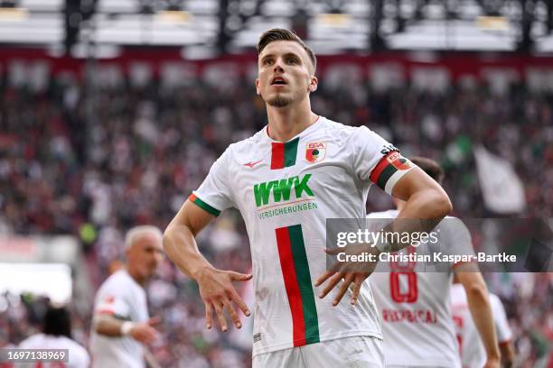 Ermedin Demirovic of FC Augsburg celebrates after scoring the team's second goal during the Bundesliga match between FC Augsburg and 1. FSV Mainz 05...