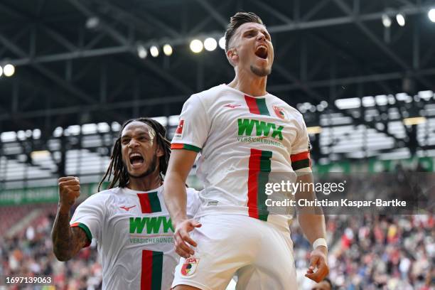 Ermedin Demirovic of FC Augsburg celebrates after scoring the team's second goal during the Bundesliga match between FC Augsburg and 1. FSV Mainz 05...