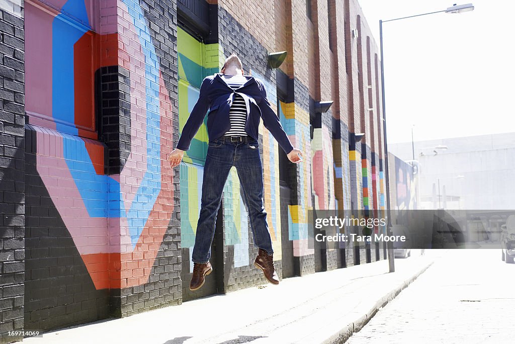 Man jumping in city