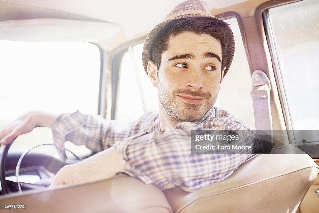 Man driving vintage car