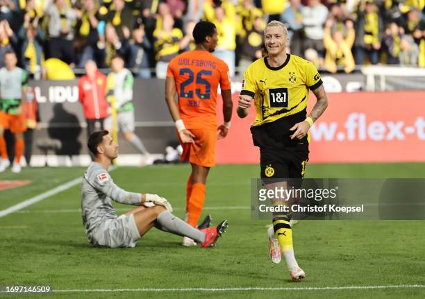 Marco Reus of Borussia Dortmund celebrates after scoring the team's first goal during the Bundesliga match between Borussia Dortmund and VfL...