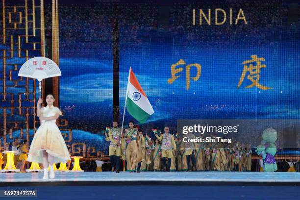 Flag bearers Hermanpreet Singh and Lovlina Borgohain lead India delegation entering the stadium during the opening ceremony of the 19th Asian Games...