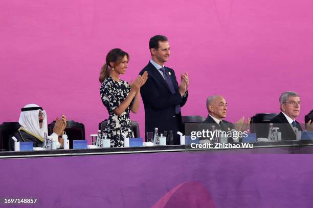 Syrian President Bashar al-Assad and his wife Asma attend the opening ceremony of the 19th Asian Games at Hangzhou Sports Park Stadium on September...