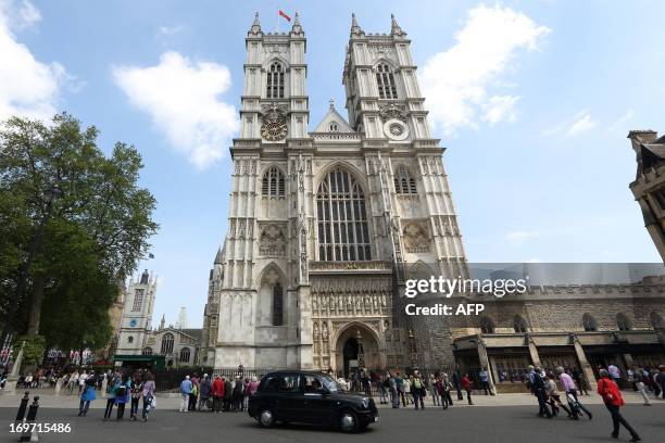 Tourists visiting Westminster Abbey in central London on May 31, 2013. Queen Elizabeth II marks the 60th anniversary of her coronation on Sunday,...