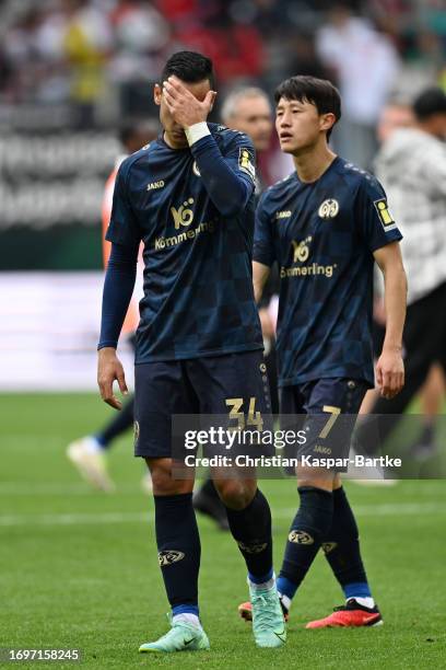 Anwar El Ghazi and Lee Jae-Song of 1.FSV Mainz 05 look dejected following the team's loss during the Bundesliga match between FC Augsburg and 1. FSV...