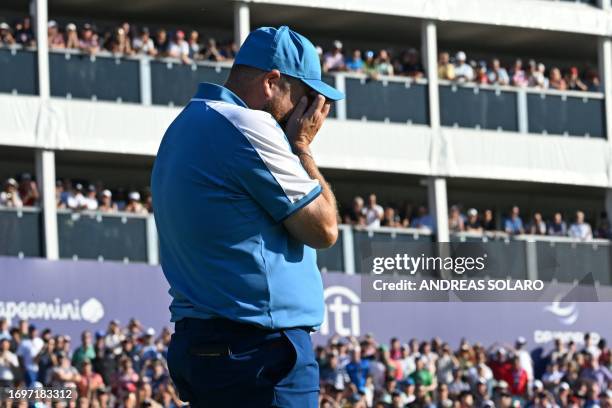 Europe's Irish golfer, Shane Lowry reacts to a missed putt on the 7th green during his foursomes match on the first day of play in the 44th Ryder Cup...