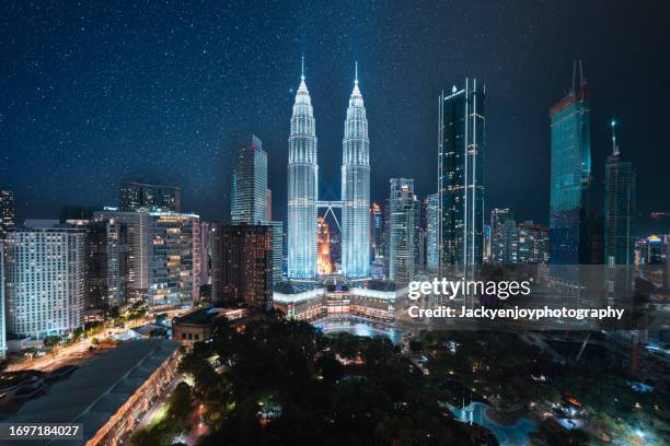 malaysia's kuala lumpur at night with star - kuala lumpur landscape stock pictures, royalty-free photos & images