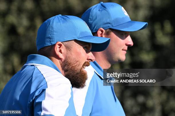 Europe's Irish golfer, Shane Lowry and Europe's Austrian golfer, Sepp Straka on the 7th green during their foursomes match on the first day of play...