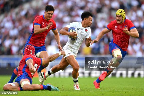 Marcus Smith of England runs with the ball whilst under pressure from Alfonso Escobar, Cristobal Game and Matias Garafulic of Chile during the Rugby...