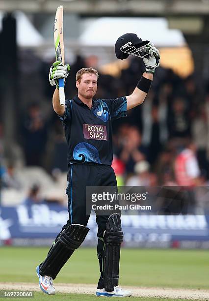 Martin Guptill of New Zealand celebrates hitting a four to make a century and win the match for New Zealand giving him a total of 103 runs during the...