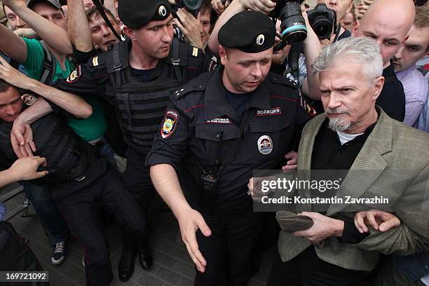 Russian riot police detain writer, opposition leader and initiator of the Strategy-31 campaign Eduard Limonov during an unsanctioned Strategy-31...