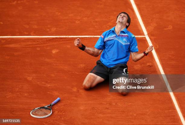 Tommy Robredo of Spain celebrates match point in his Men's Singles match against Gael Monfils of France during day six of the French Open at Roland...