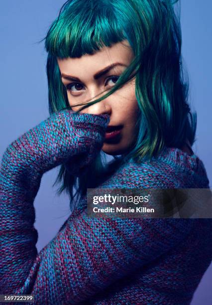 girl with blue and green hair with hand over mouth - green hair stock pictures, royalty-free photos & images