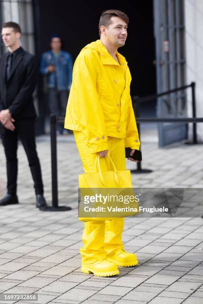 Hanan Besovic is seen wearing a monochrome yellow total look made of yellow leather boots, a yellow leather Ferragamo bag, yellow trousers and a...