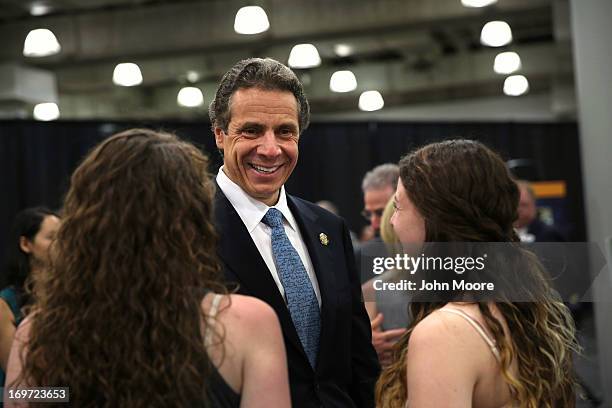 New York Governor Andrew Cuomo speaks with teenagers after announcing new bill with tougher penalties for texting while driving at a press conference...