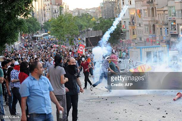 Protestors clash with Turkish riot policemen during a protest against the demolition of Taksim Gezi Park on May 31 in Taksim quarter of Istanbul....