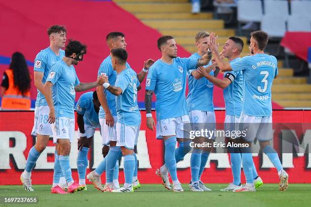 Jorgen Larsen of RC Celta celebrates with his teammtes after scoring the team's first goalduring the LaLiga EA Sports match between FC Barcelona and...