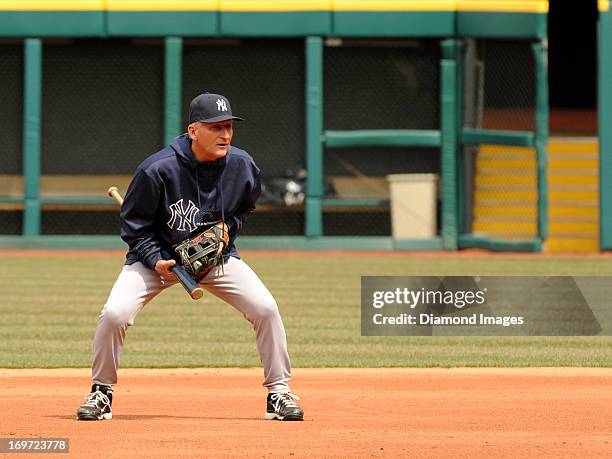 First base coach Mick Kelleher of the New York Yankees watches batting practice from the infield prior to a game against the Cleveland Indians on...