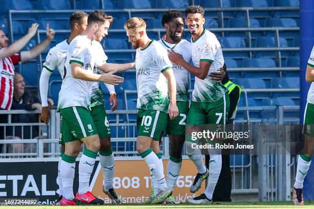 Hakeeb Adelakun of Lincoln City celebrates with team-mates after he scores a goal to make it 1-0 during the Sky Bet League One match between...