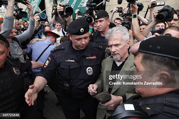 Russian riot police detain writer, opposition leader and initiator of the Strategy-31 campaign Eduard Limonov during an unsanctioned Strategy-31...