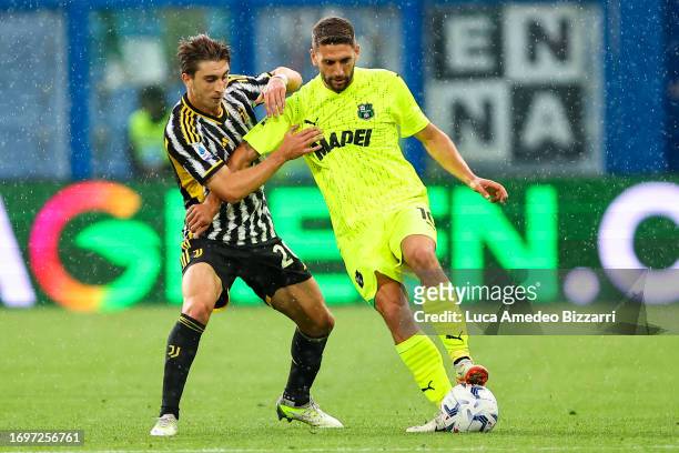 Domenico Berardi of U.S. Sassuolo Calcio competes for the ball with Fabio Miretti of Juventus FC during the Serie A TIM match between US Sassuolo and...