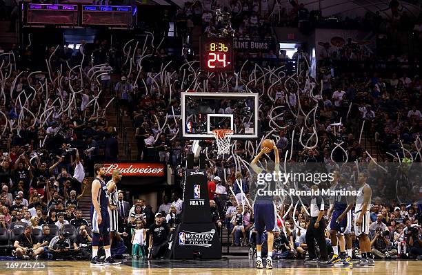 Fans of the San Antonio Spurs wave balloons in an attempt to distract Tayshaun Prince of the Memphis Grizzlies as he attempts a free throw during...