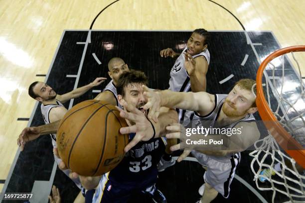 Marc Gasol of the Memphis Grizzlies attempts a shot againsty Matt Bonner of the San Antonio Spurs during Game One of the Western Conference Finals of...