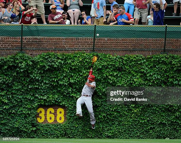 Gerardo Parra of the Arizona Diamondbacks can't catch a home run off the bat of Alfonso Soriano of the Chicago Cubs during the first inning on May...