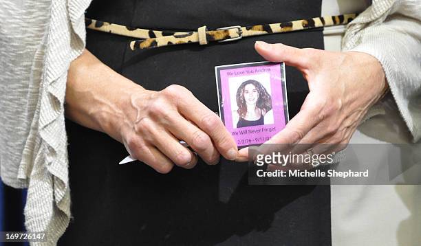 Kathleen Haberman holds a picture of her 25-year-old daughter Andrea, who was killed in the World Trade Center, while listening to a press conference...
