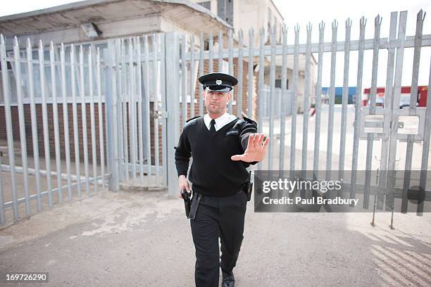 security guard holding hand out - holster stock pictures, royalty-free photos & images