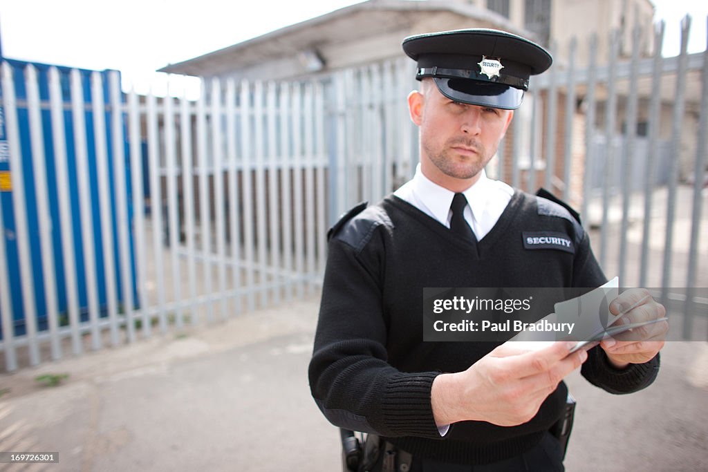 Security guard checking passport