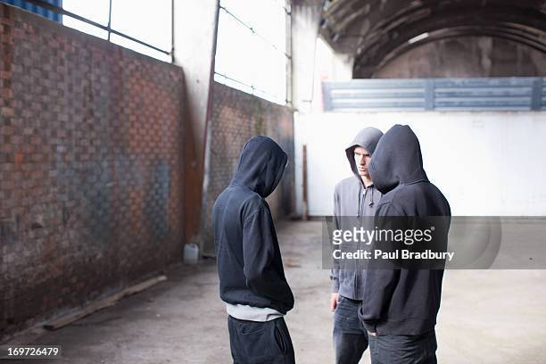 friends about to smoke marijuana - hoodie stock pictures, royalty-free photos & images