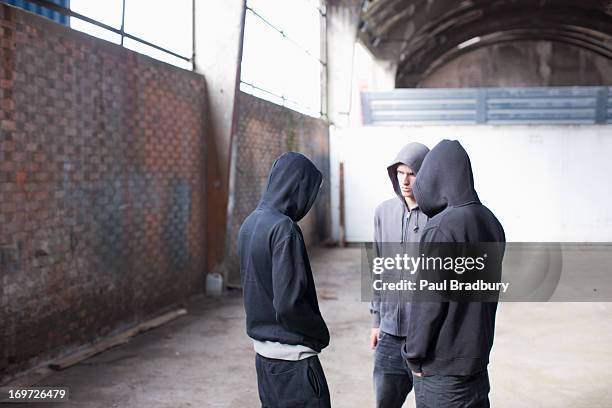 friends about to smoke marijuana - man wearing a hoodie stock pictures, royalty-free photos & images