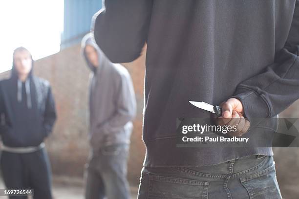 two men being confronted by man with knife - attack stock pictures, royalty-free photos & images