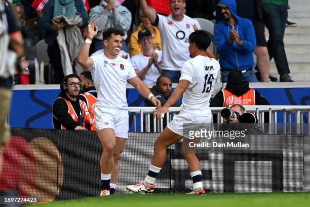 Henry Arundell of England celebrates scoring his team's ninth try with teammate Marcus Smith during the Rugby World Cup France 2023 match between...