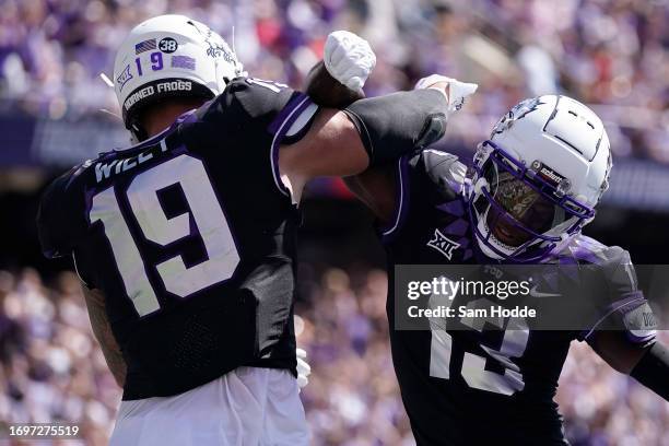 Jared Wiley of the TCU Horned Frogs is congratulated by Jaylon Robinson after scoring a touchdown during the first half against the SMU Mustangs at...