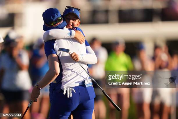 Madelene Sagstrom and Emily Kristine Pedersen of Team Europe hug on the 17th green during Day Two of The Solheim Cup at Finca Cortesin Golf Club on...