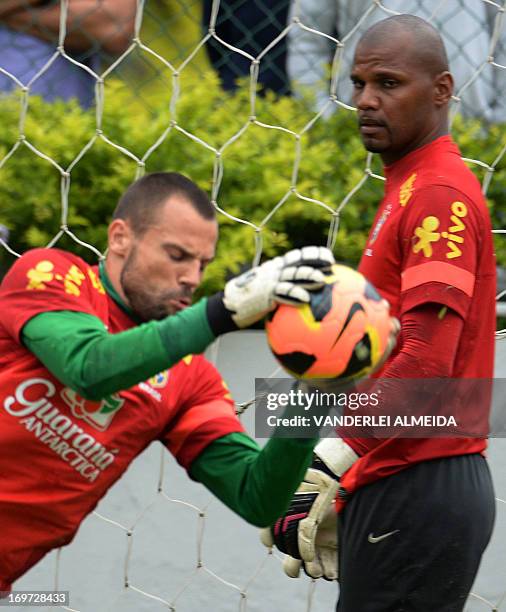 Brazilian national team goalkeepers Diego Cavarieli and Jefferson take part in a training session in Rio de Janeiro, Brazil, on May 31, 2013. Brazil...