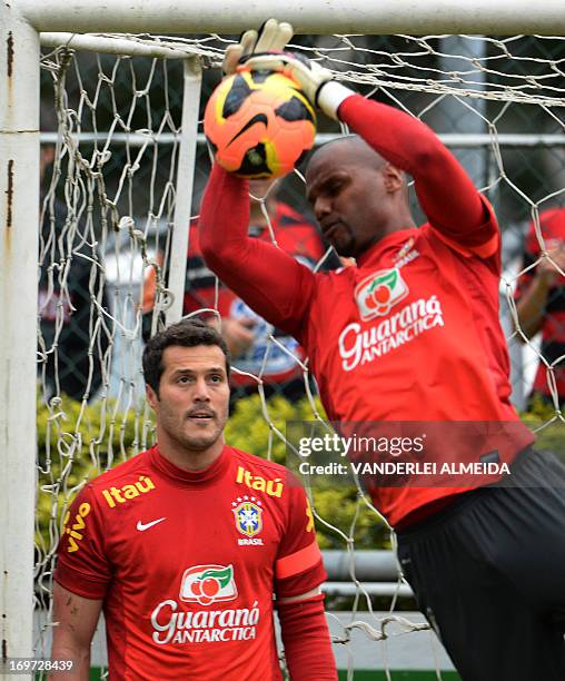 Brazilian national team goalies Julio Cesar and Jefferson take part in a training session in Rio de Janeiro, Brazil, on May 31, 2013. Brazil will...