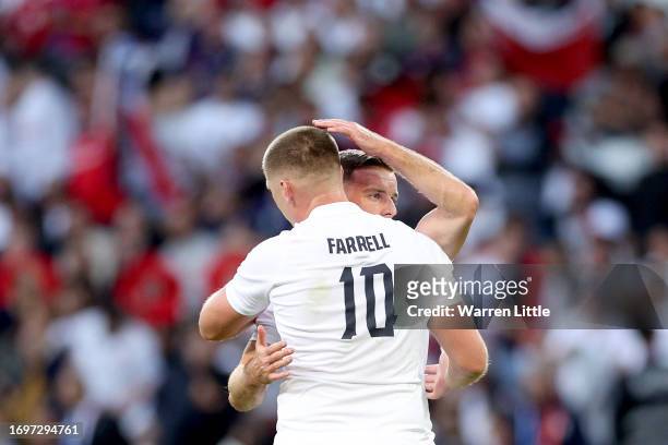 Owen Farrell of England celebrates victory with teammate George Ford during the Rugby World Cup France 2023 match between England and Chile at Stade...