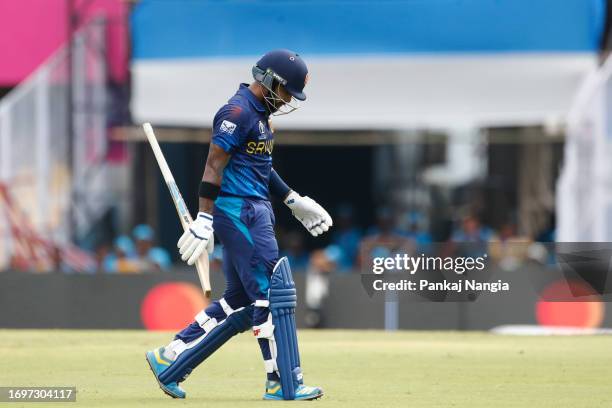 Kusal Mendis of Sri Lanka makes his way off after being dismissed during the Bangladesh and Sri Lanka warm-up match prior to the ICC Men's Cricket...