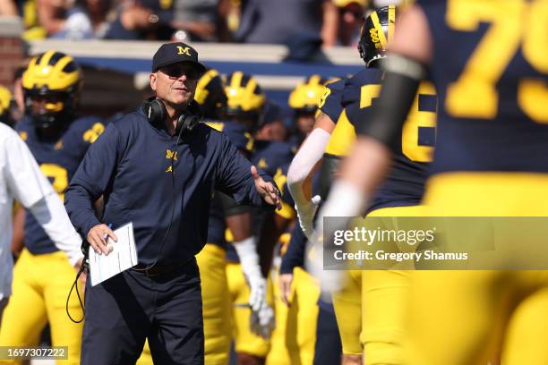 Head coach Jim Harbaugh of the Michigan Wolverines looks on in the first half while playing the Rutgers Scarlet Knights at Michigan Stadium on...